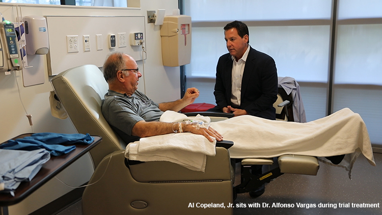 Al Copeland Jr sits with Dr Alfonso Vargas during treatment